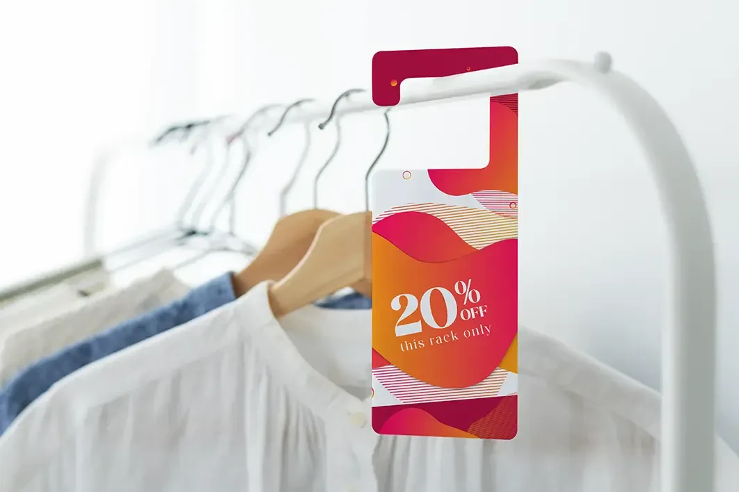 A haning tag on a clothing rack