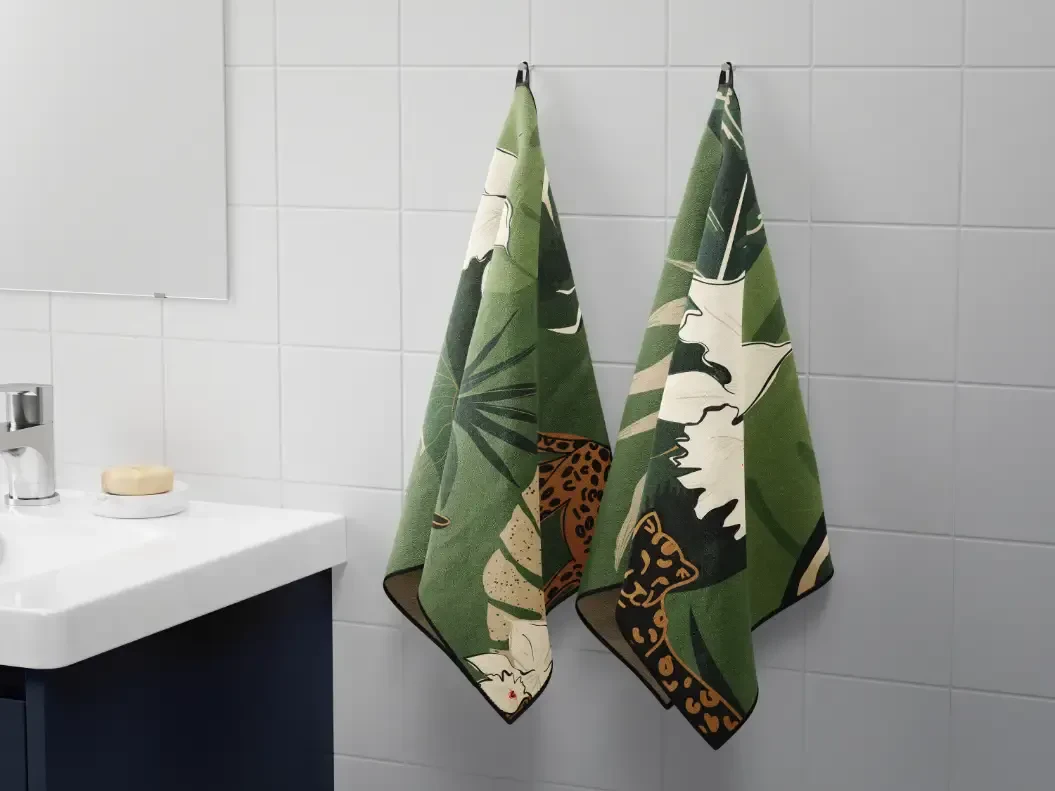 Printed hand towels hanging in a bathroom