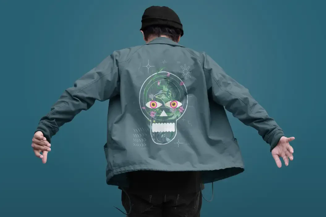 Green jacket with a skull design printed on the back