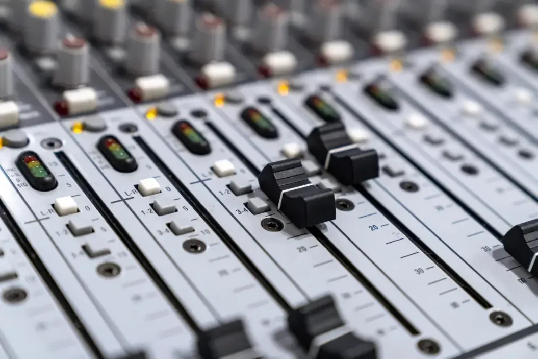 The sliders on a mixing board