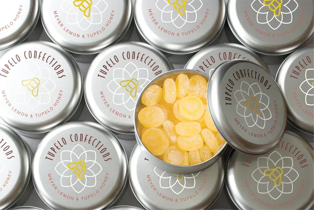 Printed lids on candy tins
