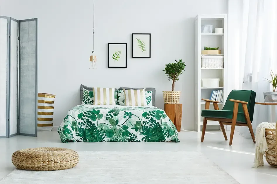 floral bedspread on a bed in a white bedroom