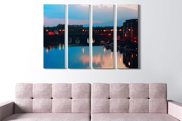 printed art canvas displayed on wall above couch